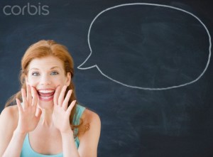 Woman standing in front of a speech bubble