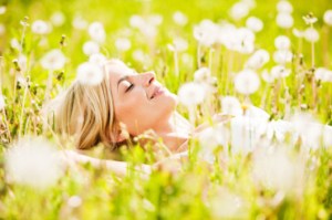 Pretty young blonde lying in the field of dandelions with her eyes closed.  [url=http://www.istockphoto.com/search/lightbox/9786750][img]http://img291.imageshack.us/img291/2613/summerc.jpg[/img][/url]